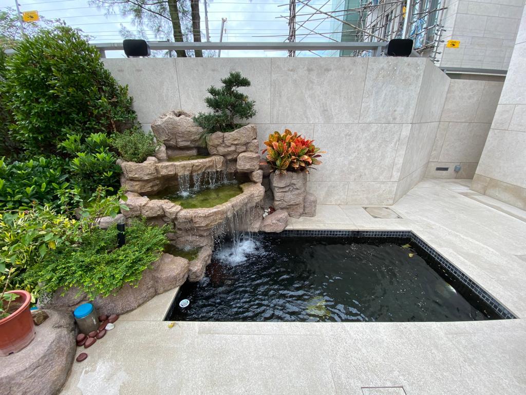 Small Backyard Pond with water features and landscaping